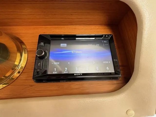 Island Dreamer Yacht Photos Pics Sony stereo system in a 1999 Riviera Convertible, mounted on a wooden dashboard.