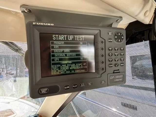 Island Dreamer Yacht Photos Pics Boat navigation system displaying startup test results on a Furuno GP-1650D.