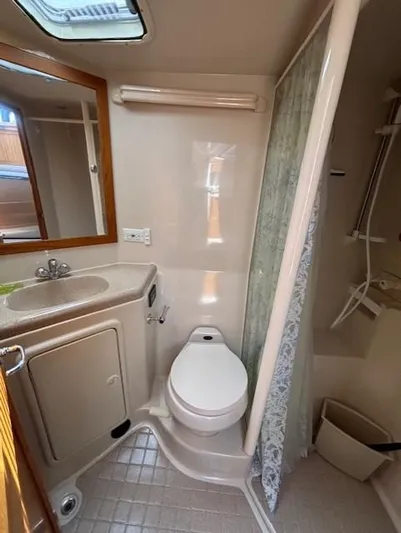 Island Dreamer Yacht Photos Pics 1999 Riviera Convertible bathroom with sink, toilet, and shower.