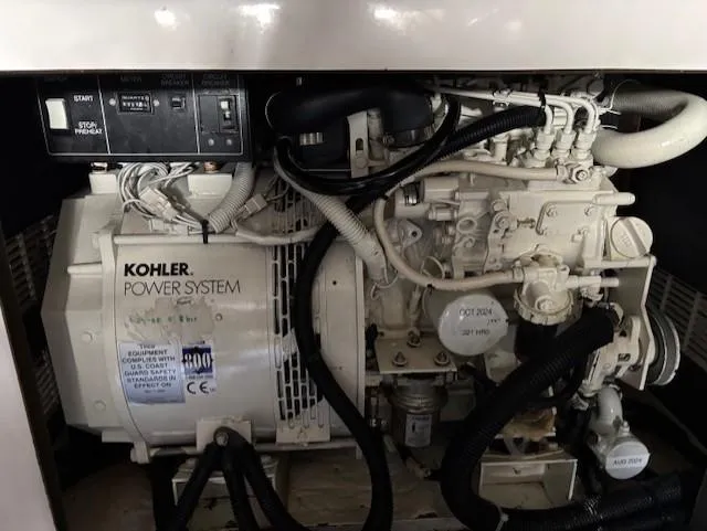 Island Dreamer Yacht Photos Pics Kohler power system in 1999 Riviera Convertible engine compartment.