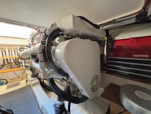 Island Dreamer Yacht Photos Pics Engine room of a 1999 Riviera Convertible with visible machinery and tools.