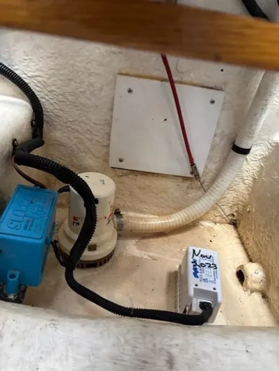 Island Dreamer Yacht Photos Pics 1999 Riviera Convertible boat interior showing wiring and pump components.