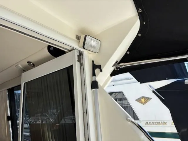 Island Dreamer Yacht Photos Pics 1999 Riviera Convertible yacht interior with sliding door and exterior view.