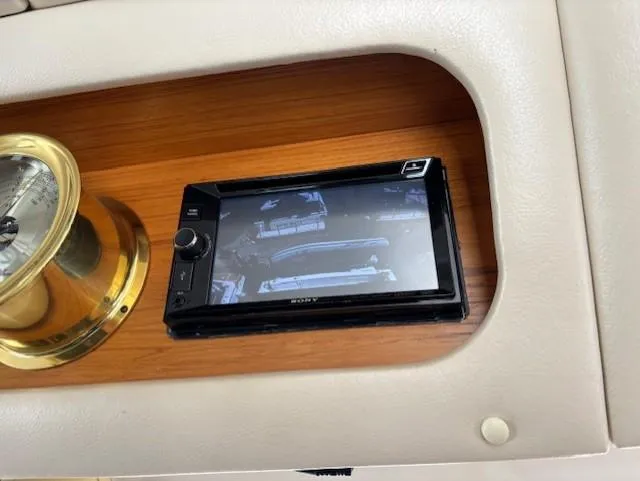 Island Dreamer Yacht Photos Pics 1999 Riviera Convertible dashboard with a Sony display and brass instrument panel.