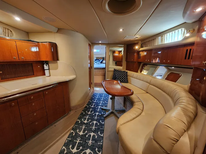 Out Last Night Yacht Photos Pics Luxurious interior of a 2000 Sea Ray 410 Sundancer yacht with elegant wood finishes.