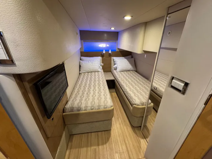  Yacht Photos Pics 2016 Formula 45 Yacht cabin with twin beds, modern decor, and ambient lighting.