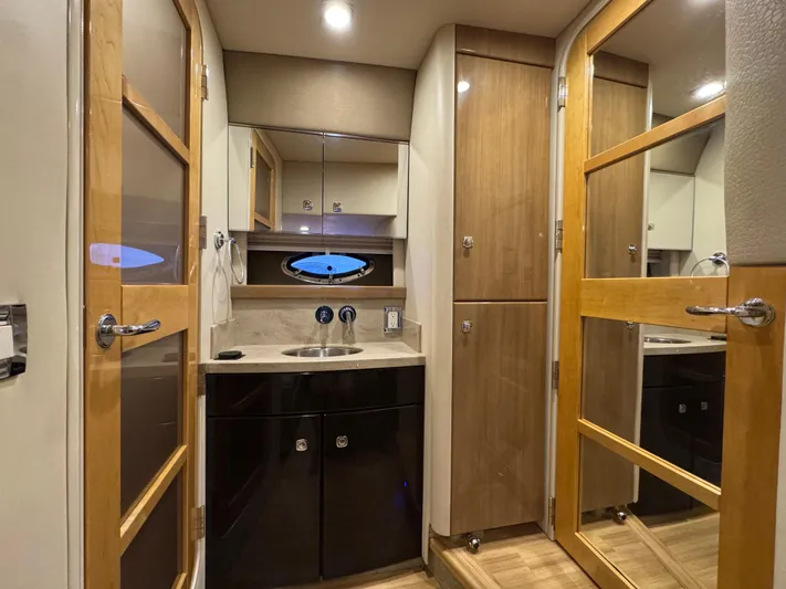  Yacht Photos Pics Interior of 2016 Formula 45 Yacht bathroom with modern fixtures and wood accents.
