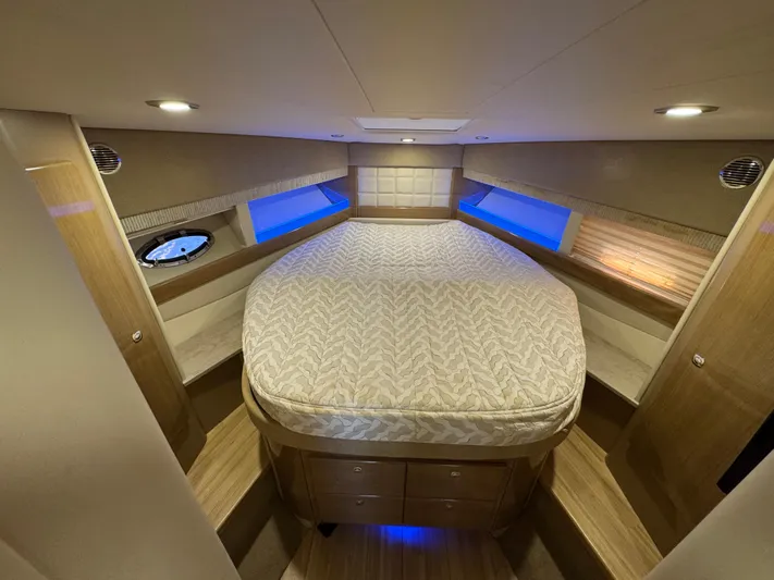  Yacht Photos Pics Luxurious interior of 2016 Formula 45 Yacht with ambient lighting and spacious bed.