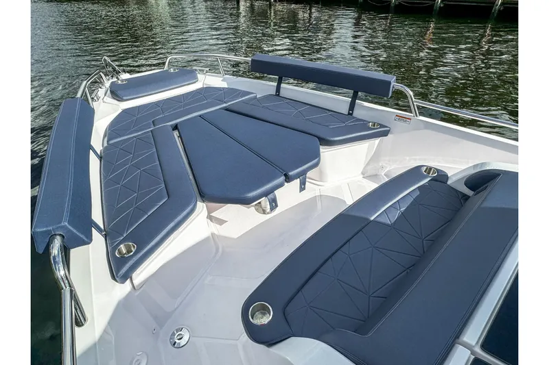  Yacht Photos Pics Luxurious seating area on 2026 Axopar 29 Sun Top boat with blue cushions.