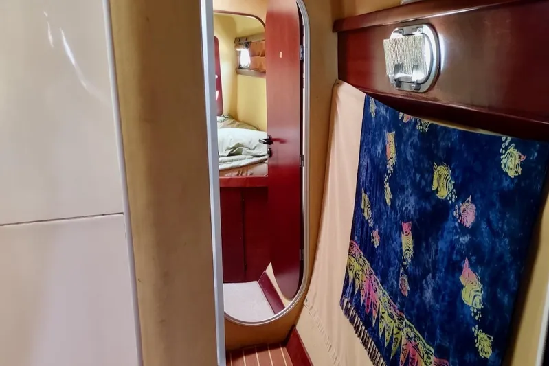 Nyango Yacht Photos Pics Interior of 1996 Fountaine Pajot Venezia 42 catamaran, featuring a cozy cabin and vibrant decor.