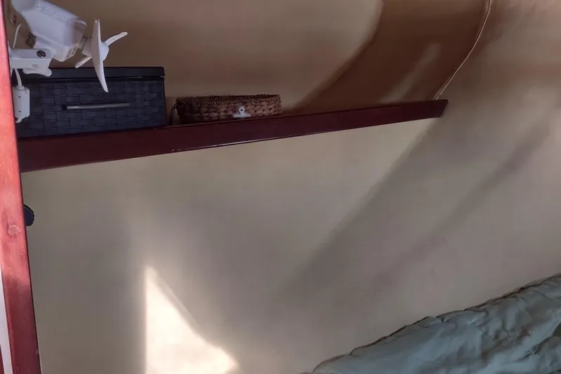 Nyango Yacht Photos Pics Interior of 1996 Fountaine Pajot Venezia 42 with shelf and storage baskets.