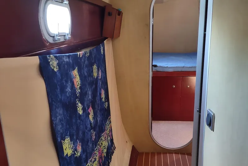 Nyango Yacht Photos Pics Interior of 1996 Fountaine Pajot Venezia 42 catamaran with cozy cabin and nautical decor.