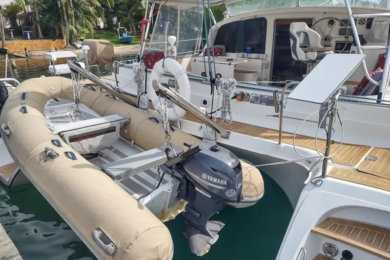 Nyango Yacht Photos Pics 1996 Fountaine Pajot Venezia 42 catamaran with Yamaha outboard motor and inflatable dinghy.