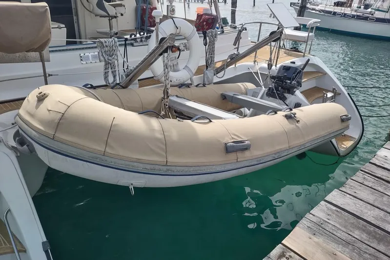 Nyango Yacht Photos Pics Inflatable dinghy attached to a 1996 Fountaine Pajot Venezia 42 catamaran.