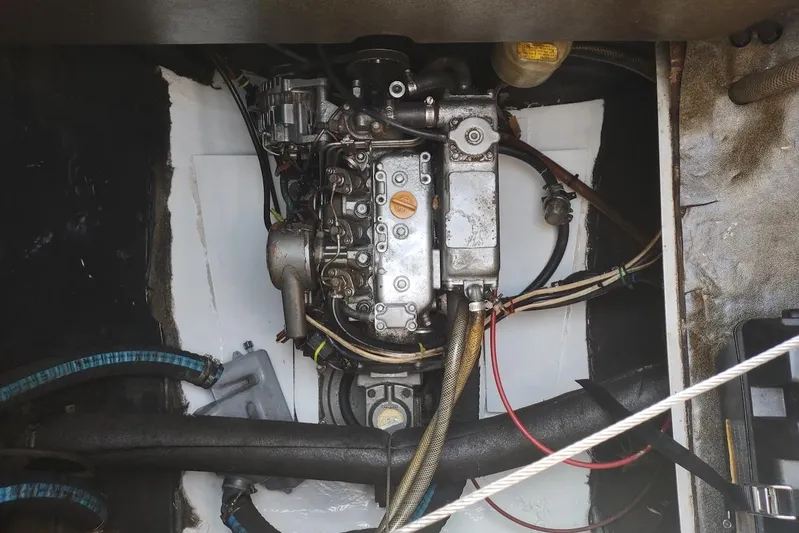 Nyango Yacht Photos Pics Engine compartment of a 1996 Fountaine Pajot Venezia 42 catamaran, showcasing mechanical components.