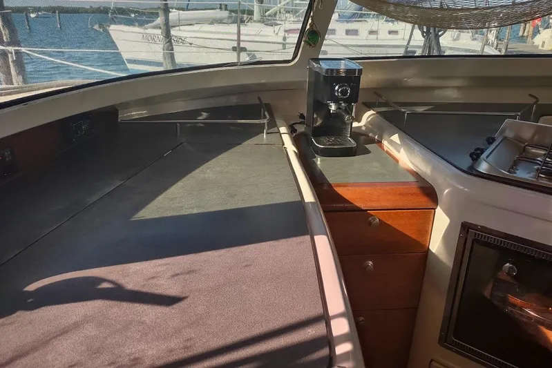 Nyango Yacht Photos Pics Interior of 1996 Fountaine Pajot Venezia 42 catamaran with kitchen area and coffee maker.