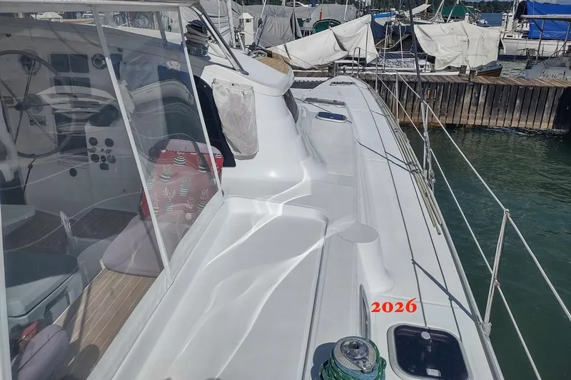 Nyango Yacht Photos Pics 1996 Fountaine Pajot Venezia 42 catamaran docked at marina, showcasing deck and cockpit.