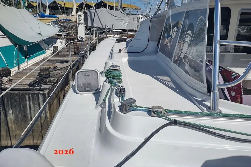 Nyango Yacht Photos Pics Deck view of 1996 Fountaine Pajot Venezia 42 catamaran docked at marina.