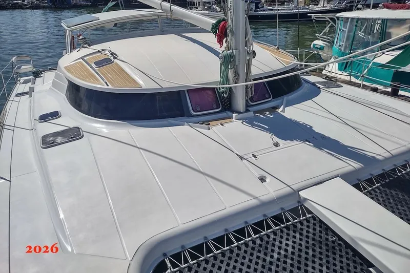 Nyango Yacht Photos Pics Fountaine Pajot Venezia 42 catamaran, 1996 model, docked at marina, sunny day.