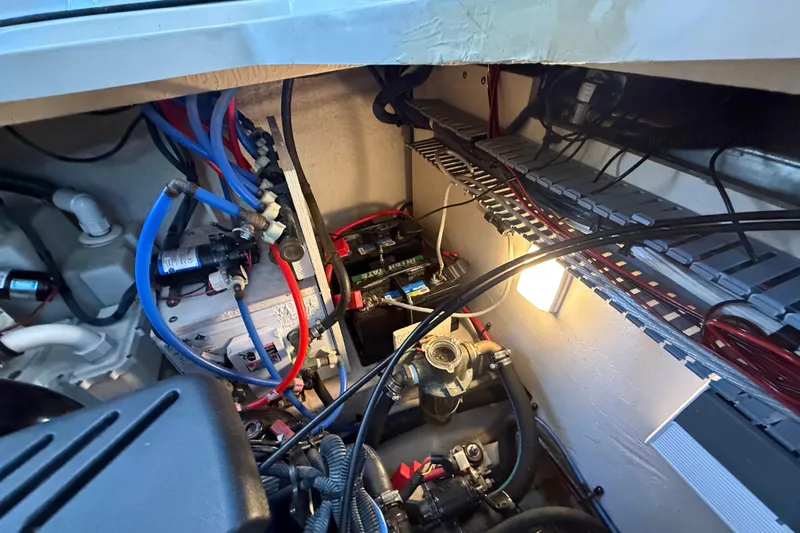 Magpie Yacht Photos Pics Engine compartment of a 2006 Sea Ray 340 Sundancer with visible wiring and components.