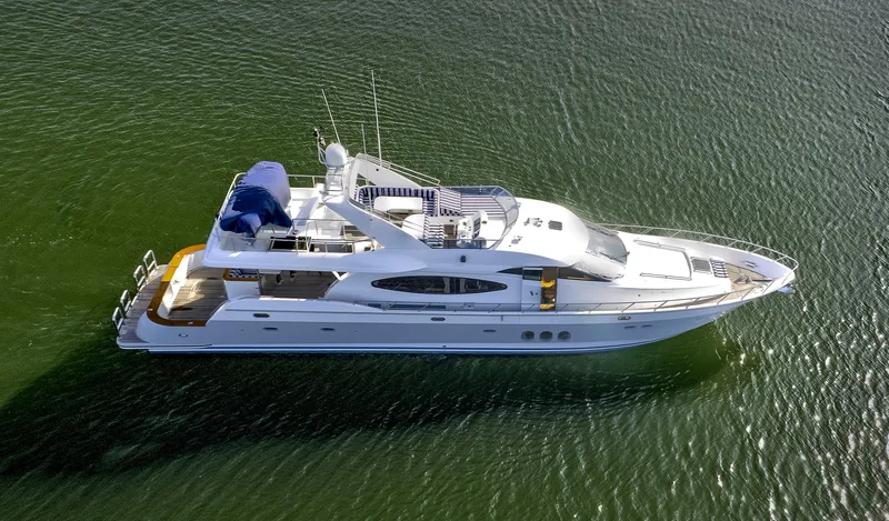 Bora Bora Yacht Photos Pics Luxurious 2009 Paragon MK yacht cruising on calm green waters.