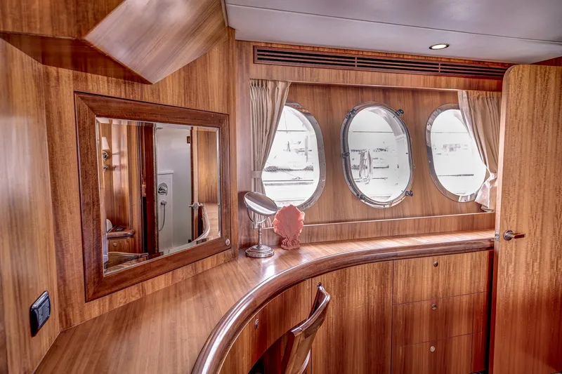 Bora Bora Yacht Photos Pics Luxurious wooden interior of 2009 Paragon mk yacht with porthole windows and vanity area.