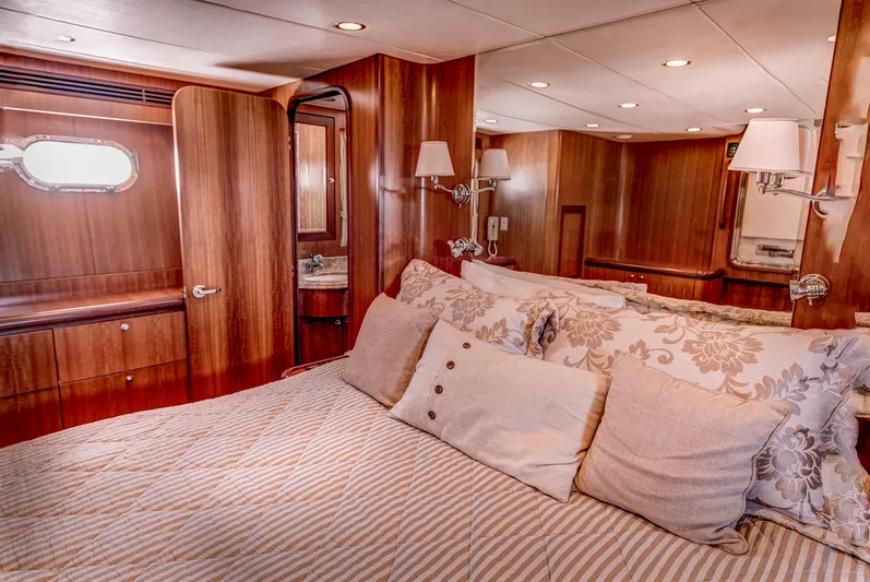 Bora Bora Yacht Photos Pics Luxurious yacht bedroom with wooden interior, plush bedding, and elegant lighting, Paragon mk 2009.