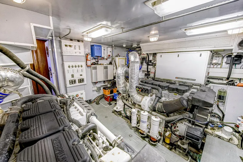 Bora Bora Yacht Photos Pics Engine room of a 2009 Paragon mk yacht, featuring complex machinery and control panels.