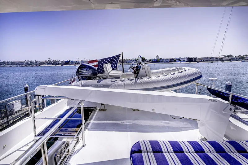 Bora Bora Yacht Photos Pics Luxury yacht deck with inflatable boat, American flag, and ocean view, Paragon mk 2009 model.