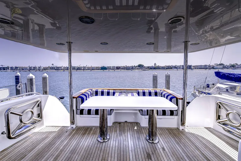 Bora Bora Yacht Photos Pics Luxurious 2009 Paragon mk yacht deck with seating, table, and waterfront view.