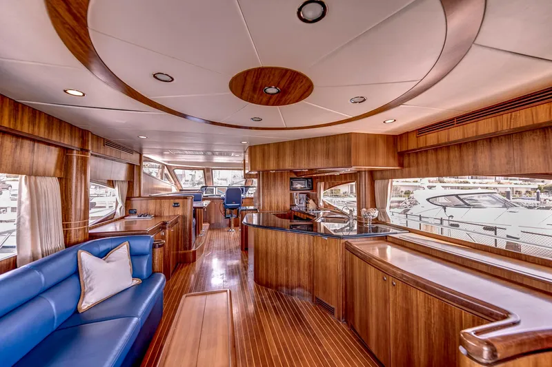 Bora Bora Yacht Photos Pics Luxurious 2009 Paragon MK yacht interior with wooden finishes and blue seating.