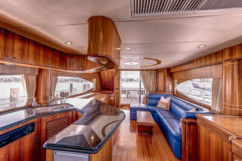 Bora Bora Yacht Photos Pics Luxurious 2009 Paragon mk yacht interior with wood finishes and blue seating.