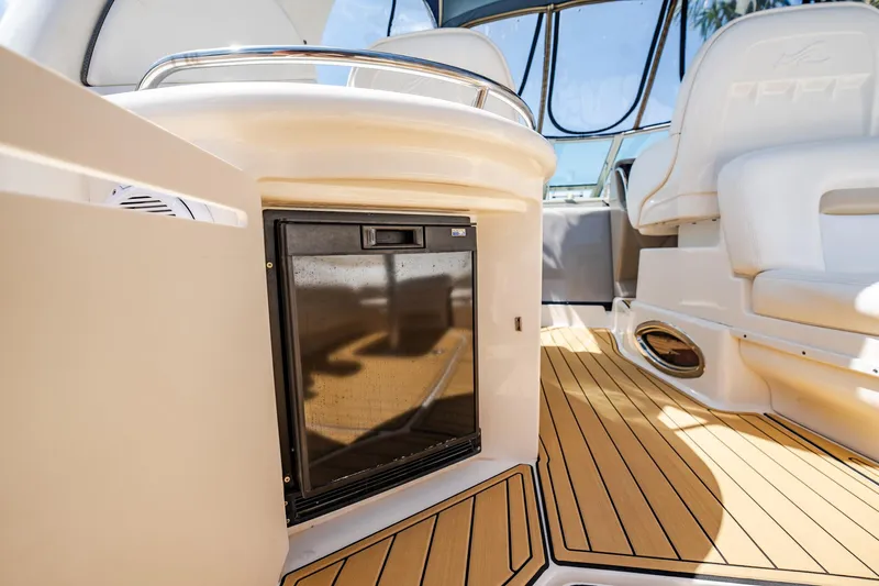 Bella Vita Yacht Photos Pics 2008 Sea Ray 340 Sundancer interior with fridge and seating, featuring teak flooring.