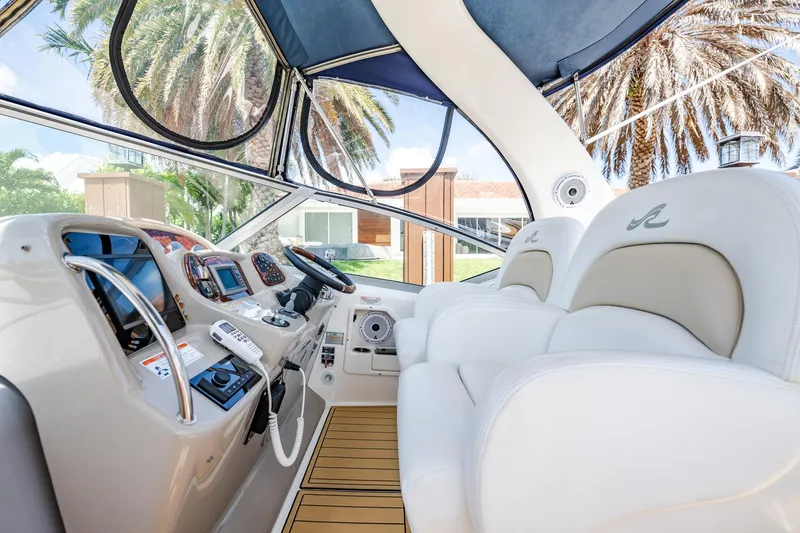 Bella Vita Yacht Photos Pics Interior of 2008 Sea Ray 340 Sundancer yacht with luxurious seating and modern controls.
