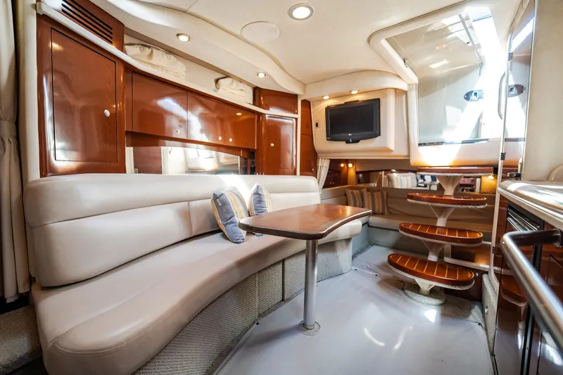 Bella Vita Yacht Photos Pics Luxurious interior of 2008 Sea Ray 340 Sundancer yacht with plush seating and wooden accents.