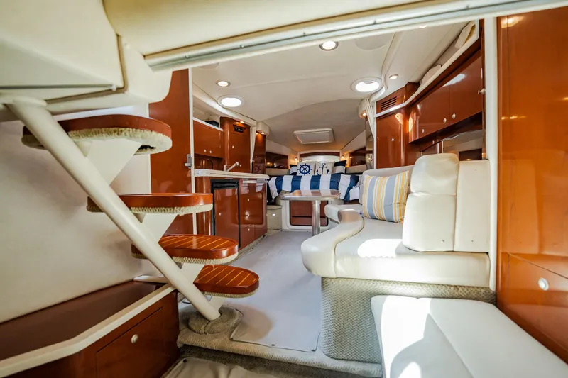 Bella Vita Yacht Photos Pics Interior of 2008 Sea Ray 340 Sundancer yacht with luxurious seating and wooden cabinetry.
