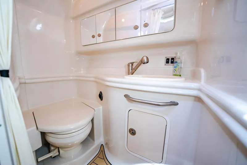Bella Vita Yacht Photos Pics 2008 Sea Ray 340 Sundancer bathroom with white fixtures and compact design.