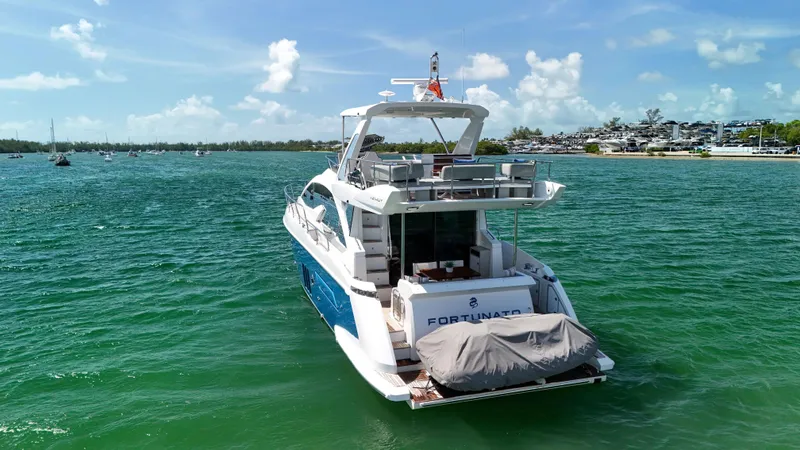 Fortunato Yacht Photos Pics Azimut 50 Flybridge 2016 yacht on serene water with clear skies.