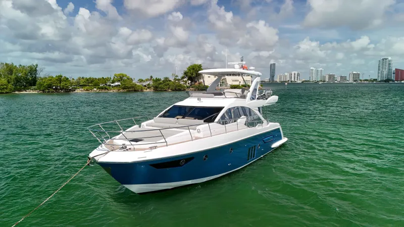 Fortunato Yacht Photos Pics Azimut 50 Flybridge 2016 yacht on water with city skyline background.