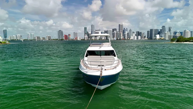 Fortunato Yacht Photos Pics Azimut 50 Flybridge 2016 yacht on water with city skyline in background.