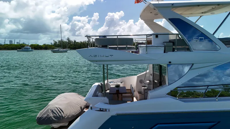 Fortunato Yacht Photos Pics 2016 Azimut 50 Flybridge yacht on serene water with clear skies.