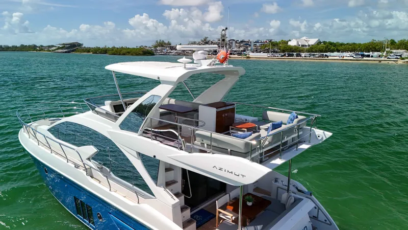 Fortunato Yacht Photos Pics 2016 Azimut 50 Flybridge yacht cruising on clear blue waters.