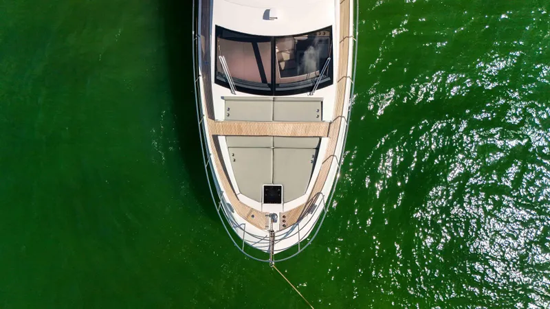 Fortunato Yacht Photos Pics Overhead view of 2016 Azimut 50 Flybridge yacht on green water.