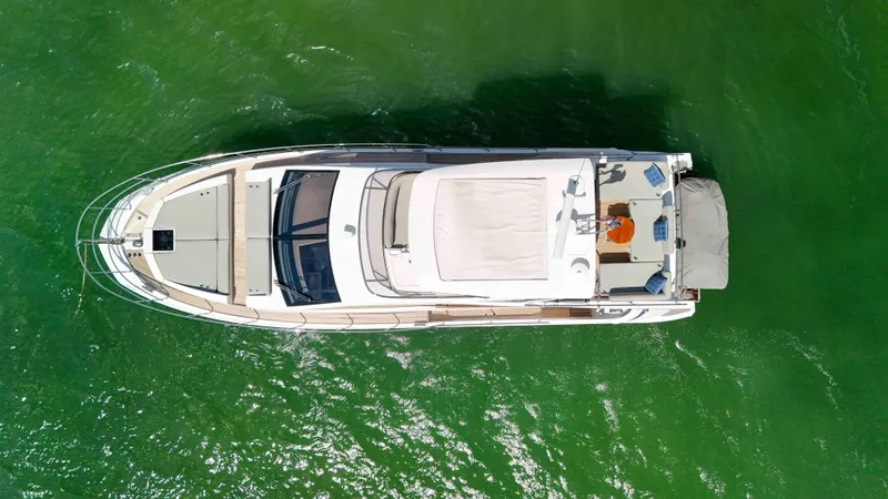 Fortunato Yacht Photos Pics Overhead view of 2016 Azimut 50 Flybridge yacht on green water.