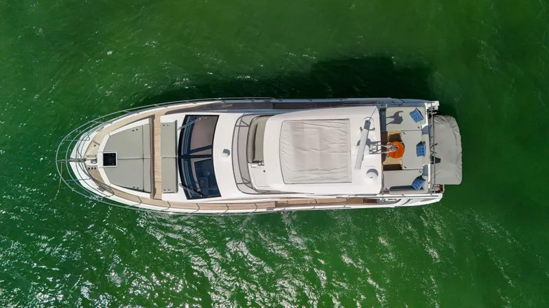 Fortunato Yacht Photos Pics Overhead view of 2016 Azimut 50 Flybridge yacht on green water.