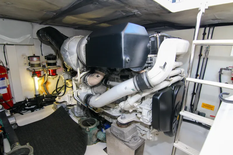 Fortunato Yacht Photos Pics Engine room of 2016 Azimut 50 Flybridge yacht, featuring mechanical components and safety equipment.