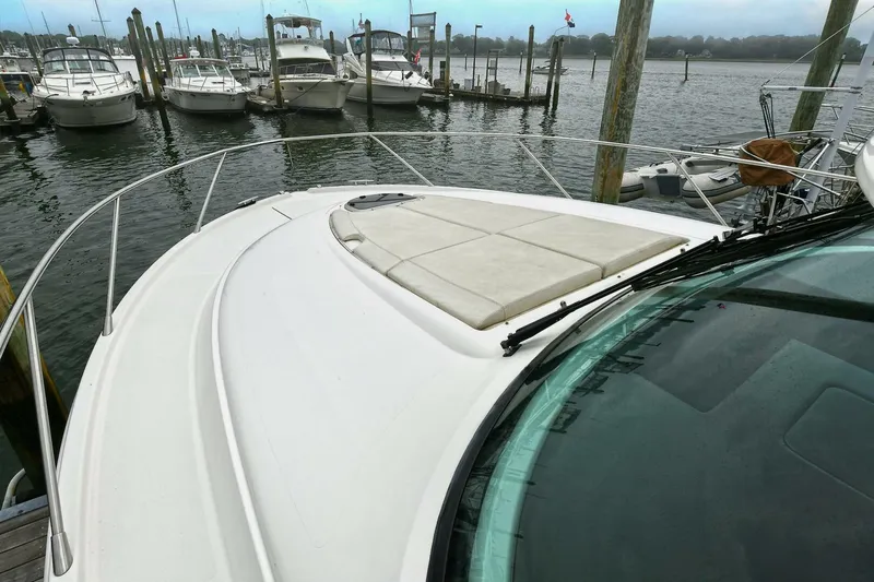  Yacht Photos Pics 2015 Tiara Yachts C44 Coupe docked, showcasing spacious deck and marina view.