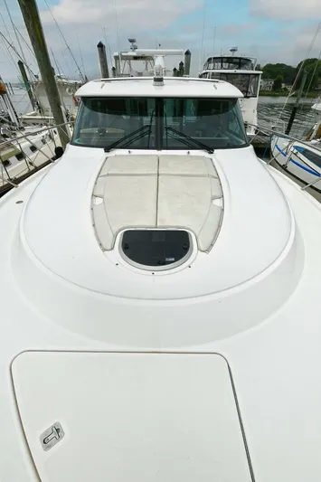  Yacht Photos Pics 2015 Tiara Yachts C44 Coupe, sleek design, docked at marina.