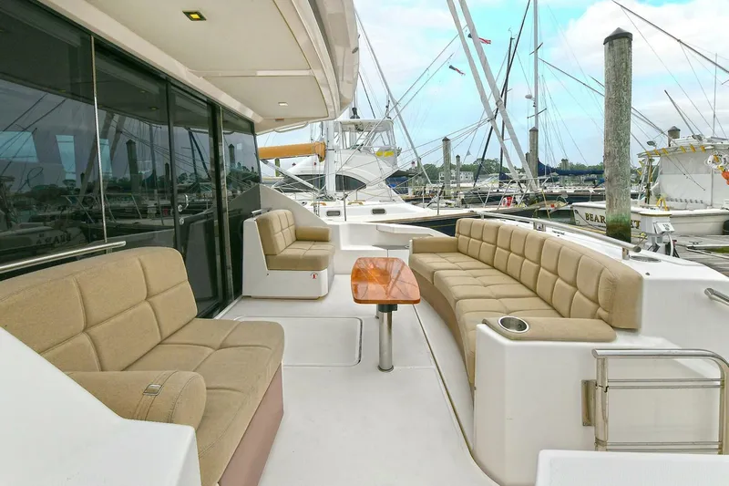  Yacht Photos Pics 2015 Tiara Yachts C44 Coupe with spacious outdoor seating and elegant design.