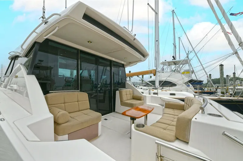  Yacht Photos Pics 2015 Tiara Yachts C44 Coupe with spacious outdoor seating and elegant design.